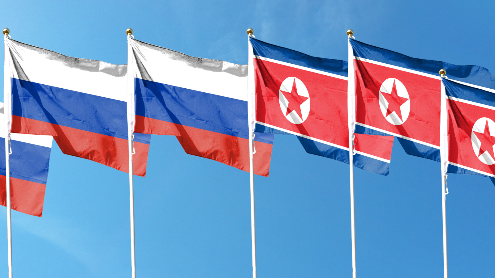 Image of Russian and North Korean flags flying next to each other.