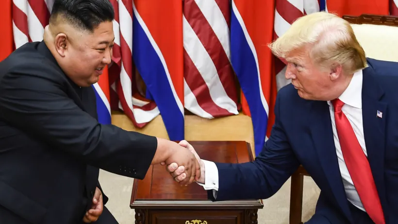 Kim Jong Un shaking President Trump's hand