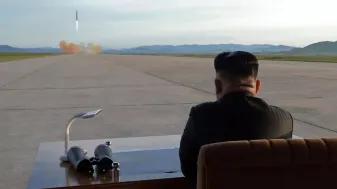 Kim Jong Un watching a missile launch.